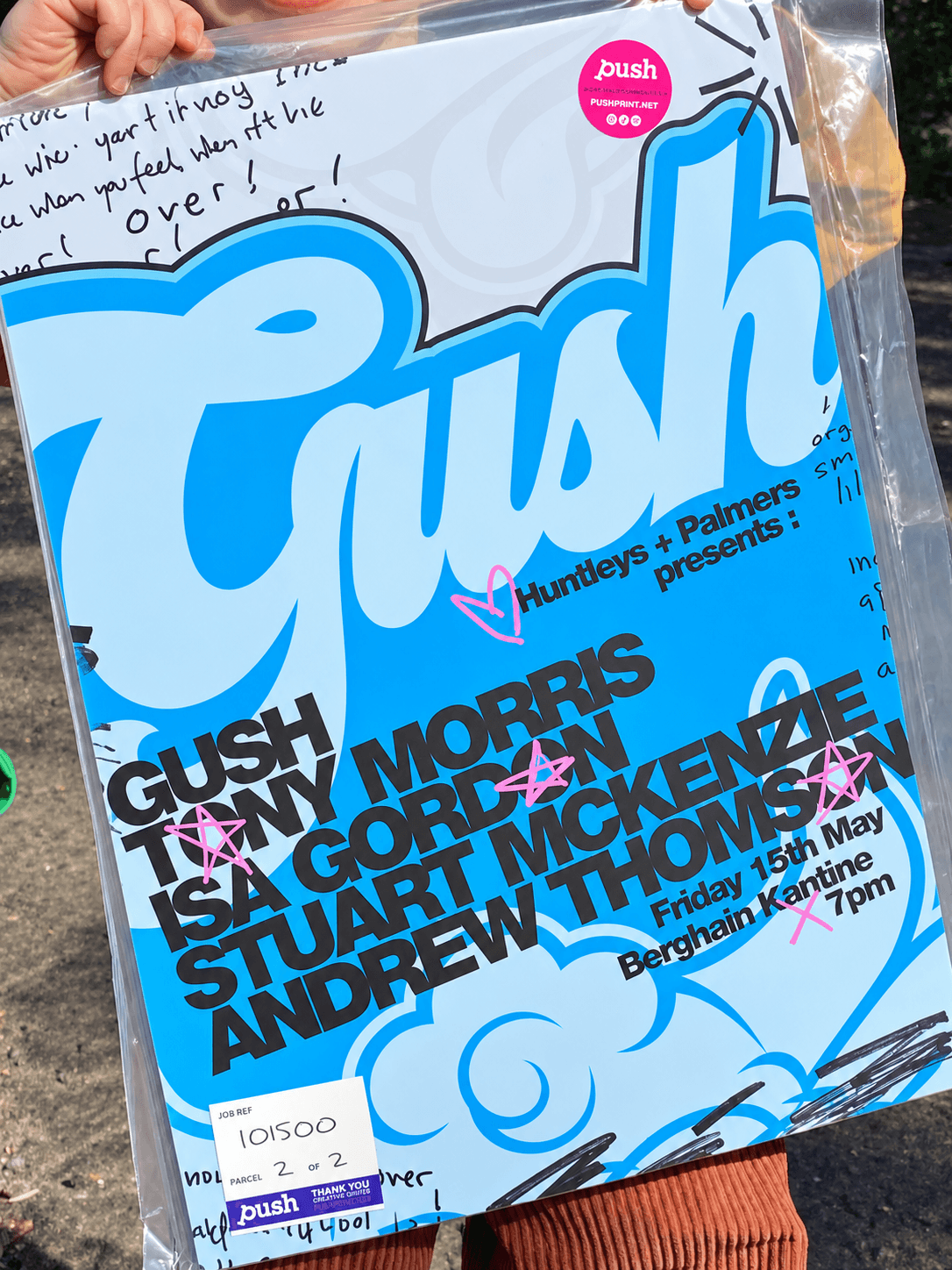 Printed blue and white release poster held inside a clear sleeve