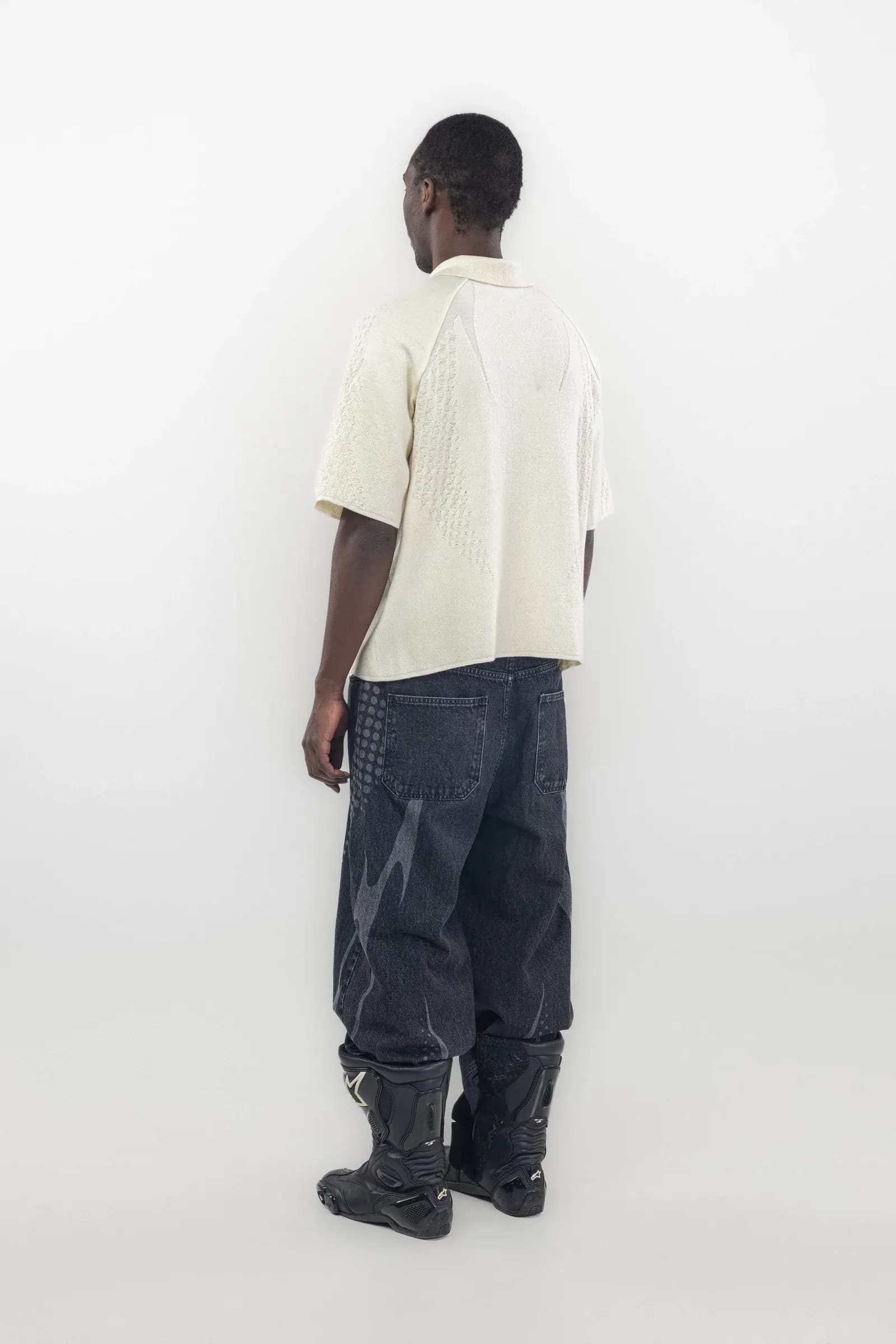 Rear of a cream polo with textured sleeves