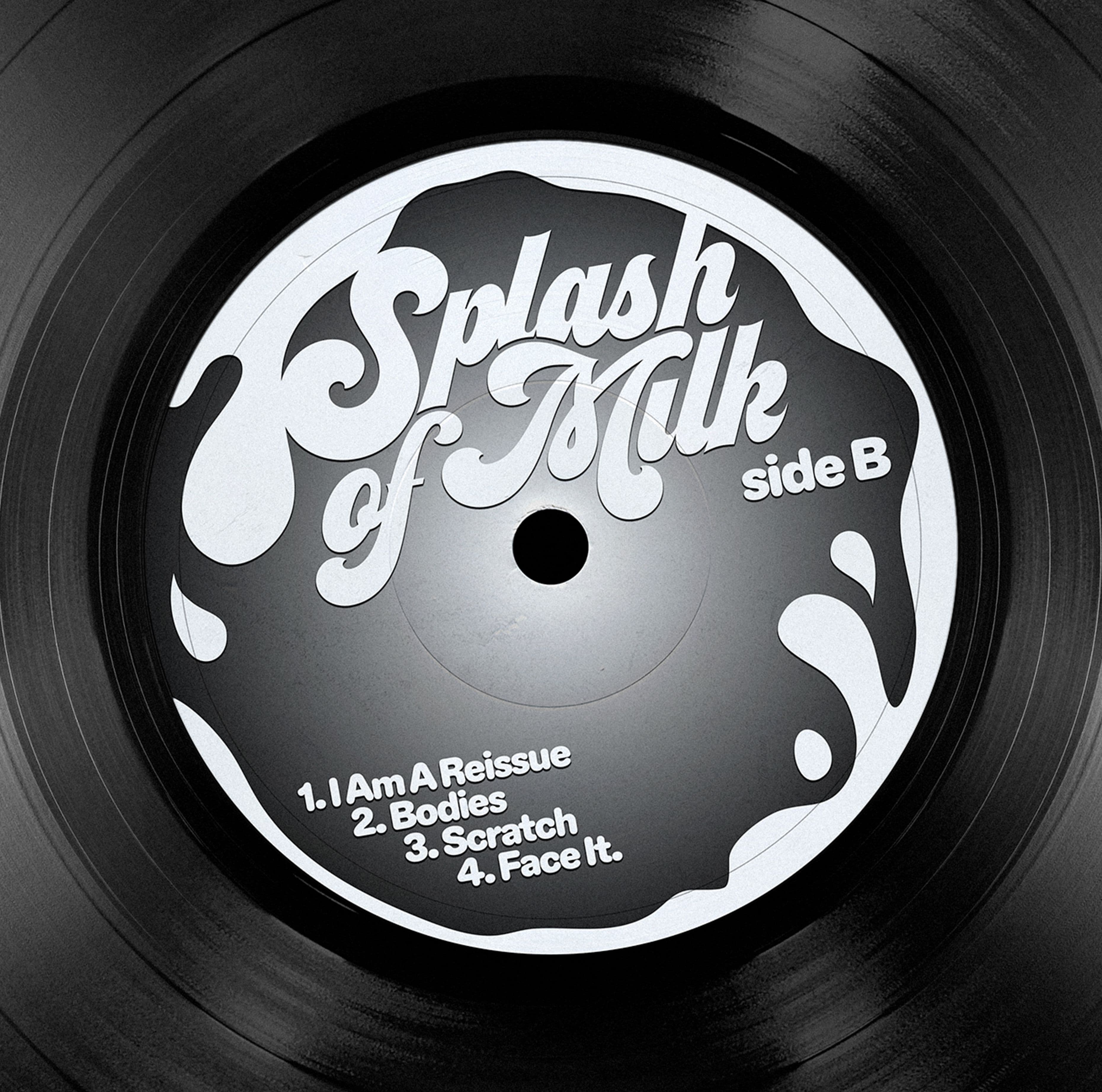 Black vinyl with a side B label featuring white script and milk splash shapes