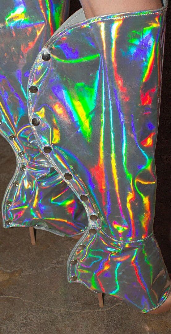 Close view of an iridescent transparent garment with visible fasteners