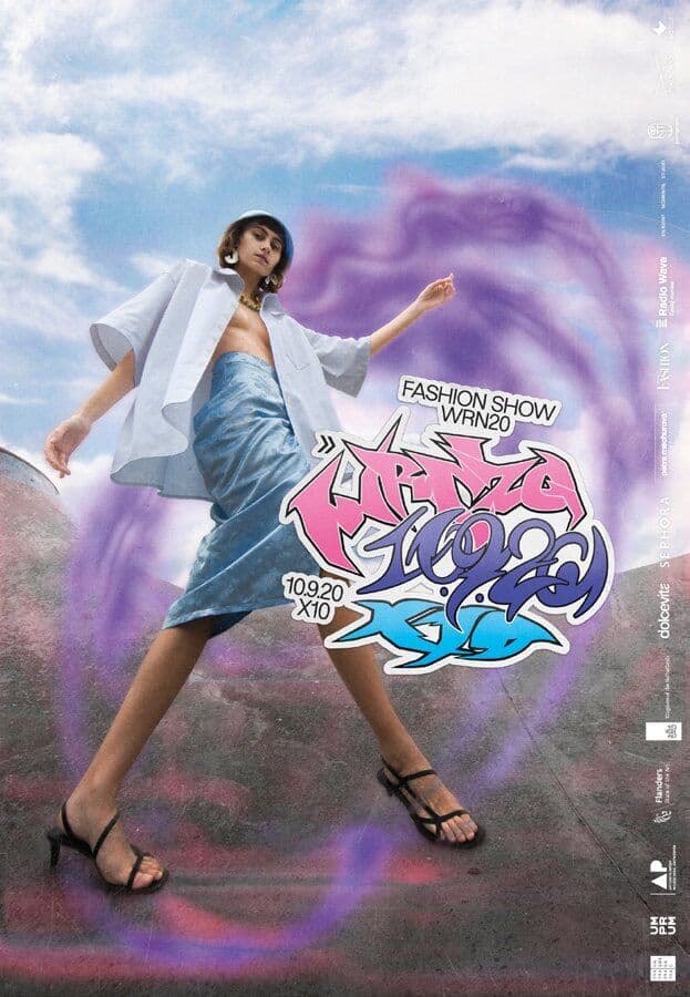 Model in a white top and blue denim skirt against a cloudy sky, purple ring and graffiti campaign lettering